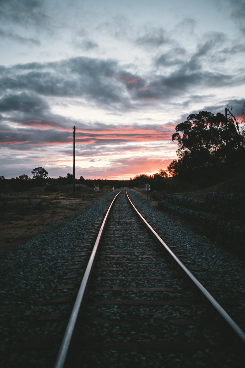 silhouette, outdoors, direction, red sky, dusk, straight, narrandera, transport, transportation, no people, train, rail, environment, diminishing perspective