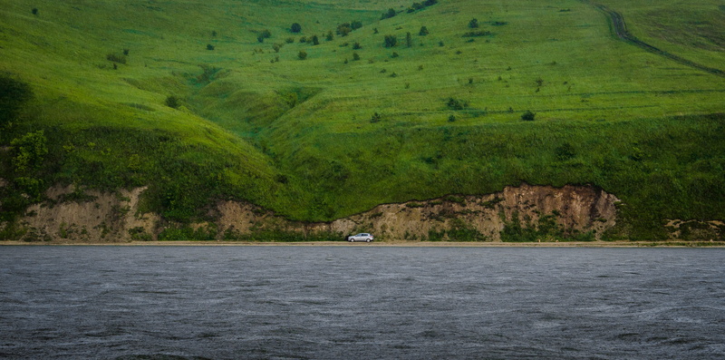 tranquility, coast, shore, tree, day, non-urban scene, car, waterfront, wave, plant, view into land, beach, automotive, landscape, water, scenics - nature