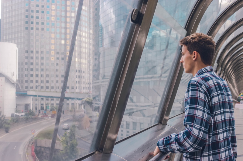 waist up, city, la défense, office building exterior, adult, transportation, window, outdoors, real people, one person, men, young adult, standing, vehicle