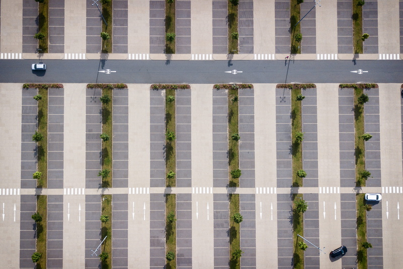 pattern, security, no people, full frame, barrier, fence, cars, capital letter, outdoors, drone cam, architecture, parking lot, number, drone, from above