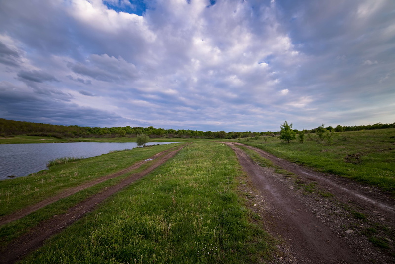 sky, long, water, beauty in nature, direction, scenic, land, clouds, pond, diminishing perspective, scenics - nature, green, transportation, outdoors, grass