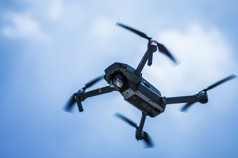 cloud - sky, camera - photographic equipment, air vehicle, indoors, day, security, airplane, focus on foreground, drone, low angle view, toy, drone cam