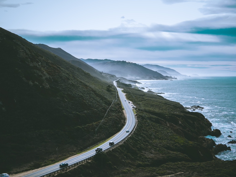 ocean, promontory, shoreline, land, mountain road, aerial view, mountain, scenics - nature, curve, 4K, water, no people, winding road, idyllic, landscape