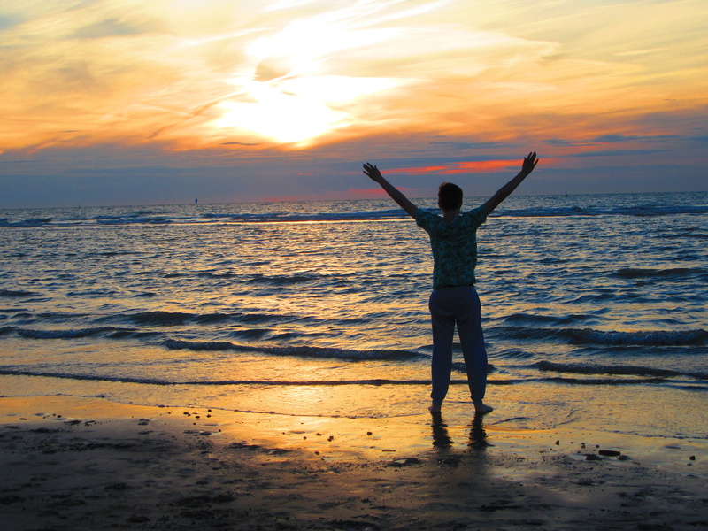 man, cheerful, boy, rear view, orange color, waves, horizon, people, sky, silhouette, cloud - sky, horizon over water, joy, beach, beauty in nature, sea