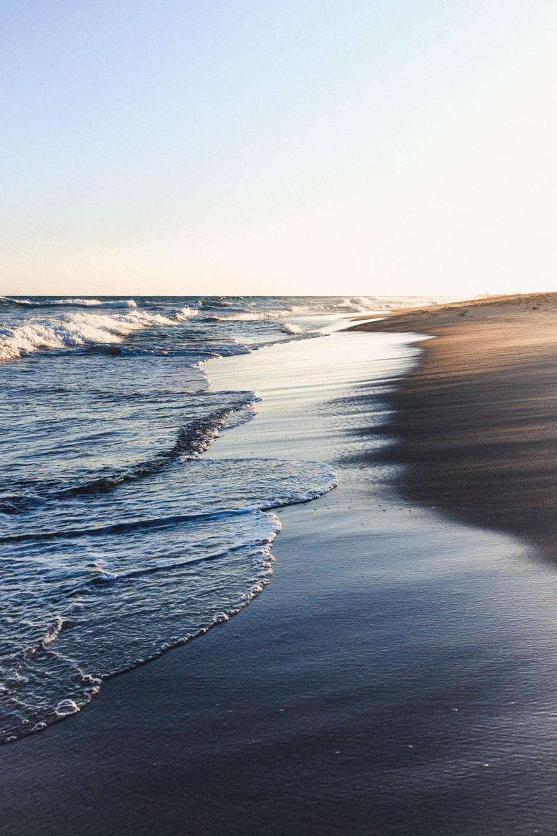 nature, motion, beach, sea, horizon over water, beauty in nature, sport, sky, surfing, tranquility, clear sky, copy space, outdoors, touching, tranquil scene