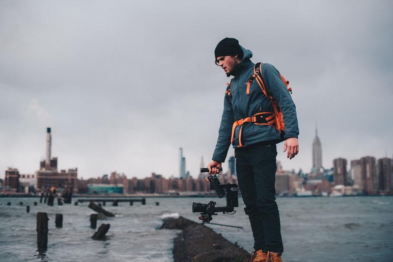 built structure, city, one person, full length, capturing, male, young men, daytime, ocean, jacket, lifestyles, leisure activity, clothing, nature, photo