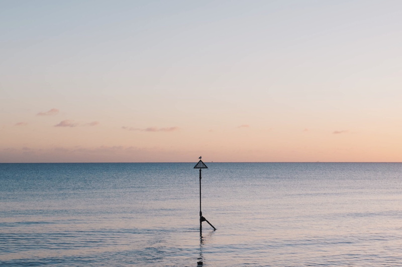 sky, pink, orange color, nature, scenics - nature, stand, tranquil scene, body, silhouette, metal, sunset, horizon, sea, one person, sunrise, minimal, water