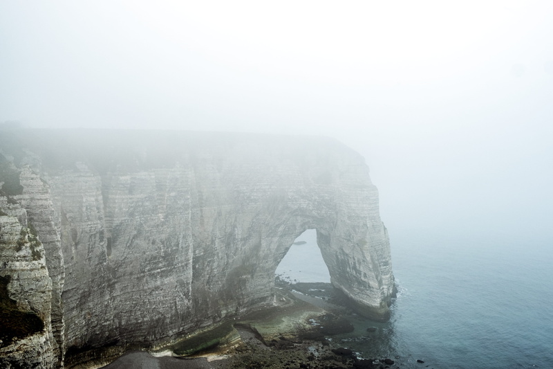 solid, surrounded, outdoors, fog, rock, tranquil scene, winter, water, foggy, hazy, environment, grey, idyllic, tranquility, no people, day, bluff, calm