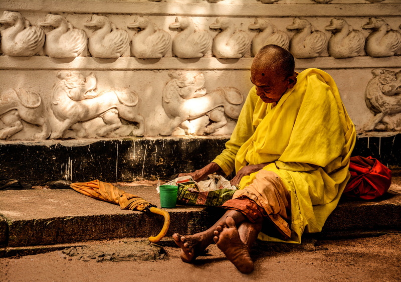 traditional clothing, robe, adult, wall, males, architecture, contemplation, 2K, outside, sitting, dirty, unhappy, art, yellow, place of worship, religion