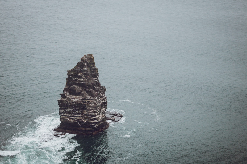 no people, high angle view, solid, coast, outdoors, rock formation, marine, nature, grey, sea, formation, waterfront, stack rock, scenics - nature, tranquil scene