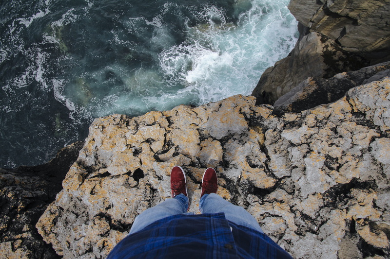 water, real people, nature, rock, sea, cliffs of moher, solid, low section, personal perspective, leisure activity, cliff, redshoes, outdoors, lifestyles