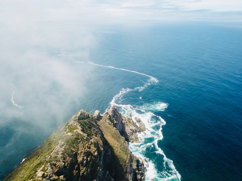 high angle view, formation, cliff, unnamed road, ocean, no people, mountain, rock, nature, aerial, cloud - sky, beauty in nature, rock formation, coast