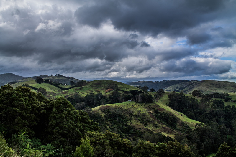 land, outdoors, sky, tranquility, countryside, slope, stormy, cloud - sky, non-urban scene, clouds, no people, environment, mountain range, australia, remote