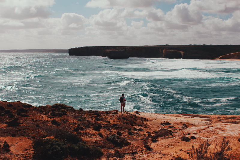sky, scenics - nature, lifestyles, nature, beach, sea, water, wave, man, beauty in nature, outdoors, rock - object, land, motion, australia, real people