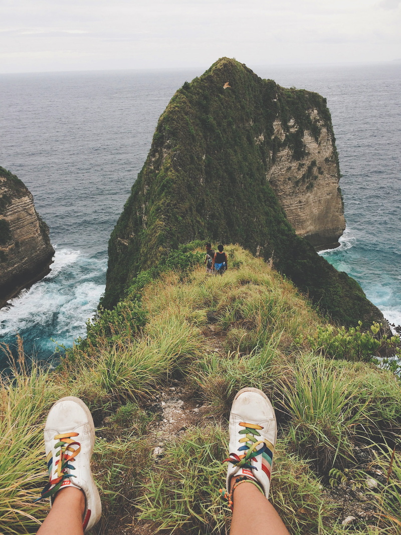 island, real people, travel, summer, low section, solid, sea, rock - object, scenics - nature, day, indonesia, explore, ocean, rock, penida island, body part