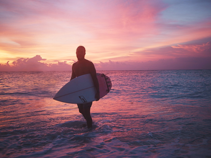 leisure activity, orange color, sun, scenics - nature, outdoors, beauty in nature, real people, surfer, 5K, lifestyles, horizon, water, surfing, cloud - sky
