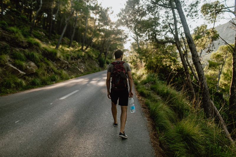 one person, real people, man, diminishing perspective, plant, outdoors, road, pathway, 5K, the way forward, direction, tree, leisure activity, walking