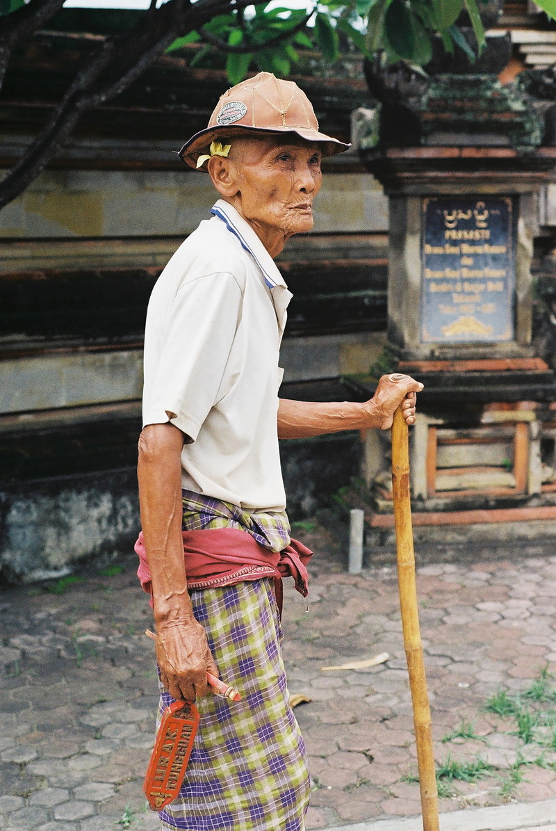 three quarter length, place of worship, real people, polo, hardhat, outdoors, wooden, lifestyles, walking, standing, 5K, traditional clothing, men, orange