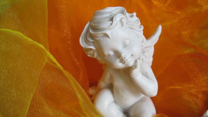 refreshment, Light, orange color, creativity, Essence, art and craft, single object, human representation, Angel, Orange, indoors, yellow, sculpture, statue