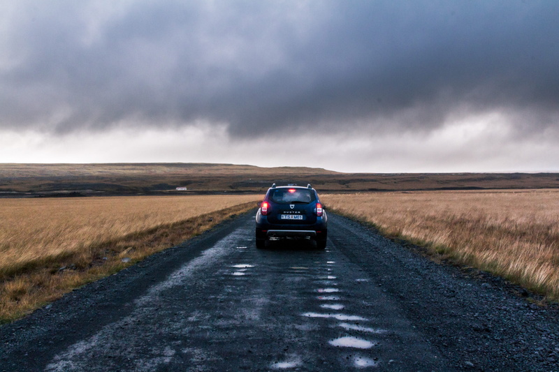 land, overcast, cloud - sky, road trip, mode of transportation, outdoors, ominous, 2K, direction, daytime, transportation, environment, dacia, horizon