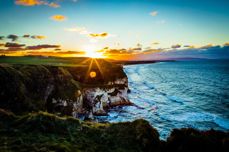 ocean, rock, tranquil scene, beach, orange color, united kingdom, red sky, sunset, land, tranquility, nature, water, solid, sky, sunlight, sea, no people