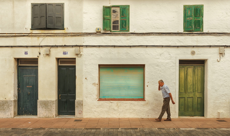 building exterior, outdoors, man, building, baleares, sant lluís, old, adult, urban, walking, full length, house, door, window, person, standing, entrance