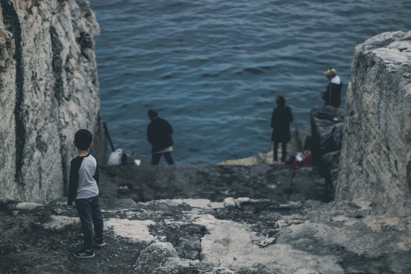 boy, 5K, women, spain, full length, outdoors, solid, rock - object, people, water, stairs, standing, sea, real people, child, nature, fishing, minorca