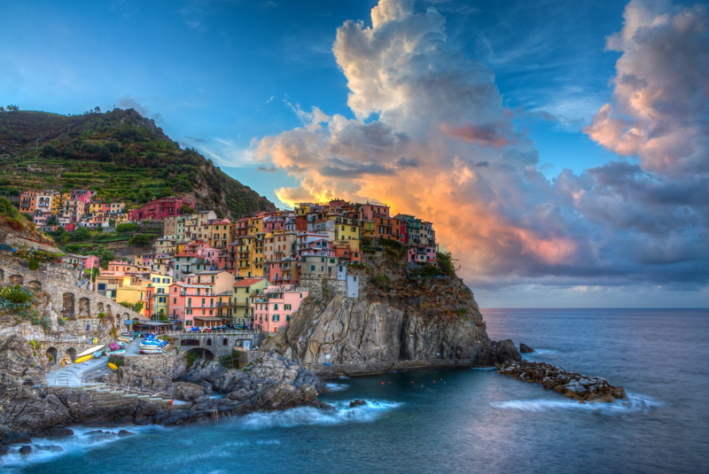 rock formation, Rock, waterfront, Village, Man Made, sky, outdoors, sea, Towns, House, Mountain, scenics - nature, horizon over water, no people, building exterior