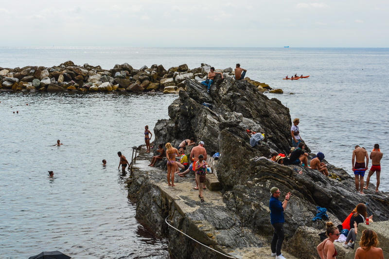 crowd, rock - object, mediterranean, water, scenics - nature, woman, seashore, outdoors, manarola, travel, bathers, coast, nature, swimmers, beach, men