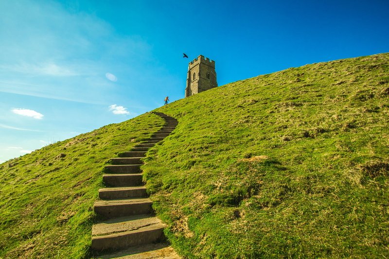 building exterior, grass, the past, famous Place, green color, nature, land, plant, day, built structure, glastonbury, low angle view, architecture, old ruin