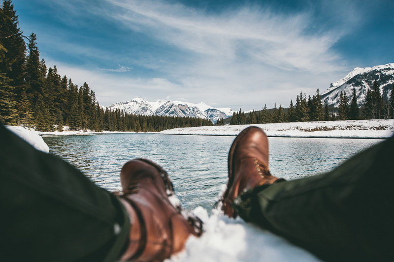 scenics - nature, boots, river, albertum, beauty in nature, limb, nature, forest, lifestyles, cold, hike, snow, lake minnewanka, feet, mountain range, body part