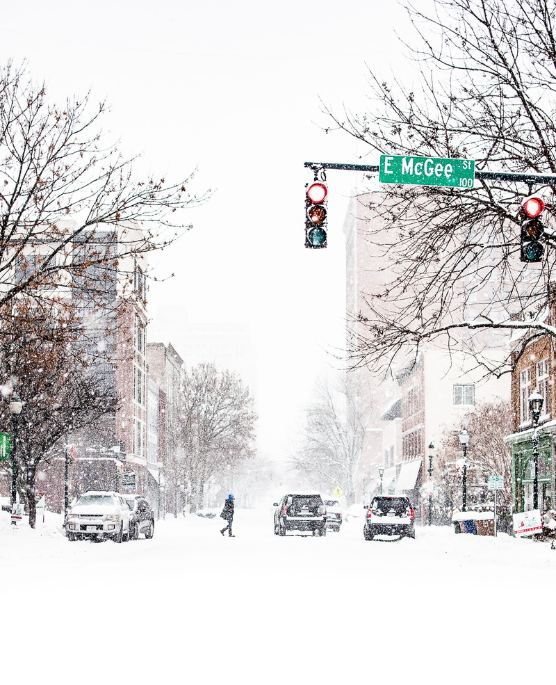 car, road, mode of transportation, snow, light, land vehicle, storm, red, vehicle, architecture, outdoors, winter, traffic, bare tree, blizzard, urban