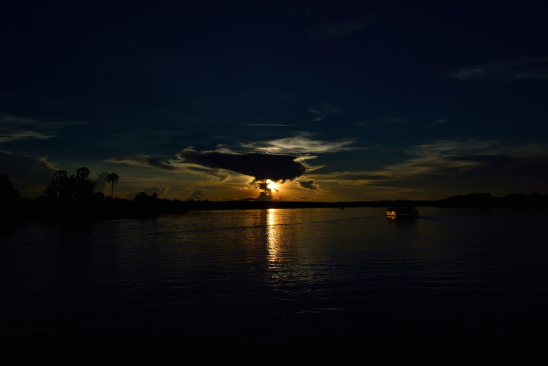 idyllic, water, tranquil scene, nature, silhouette, outdoors, sunset, reflection, zambezi, scenics - nature, victoria falls, beauty in nature, sea, sky
