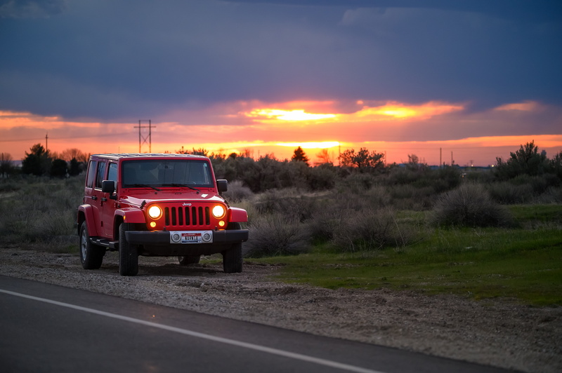 automobile, beauty in nature, beside, on the move, sky, car, red, asphalt, vehicle, orange color, cloud - sky, highway, outdoors, sunrise, land vehicle