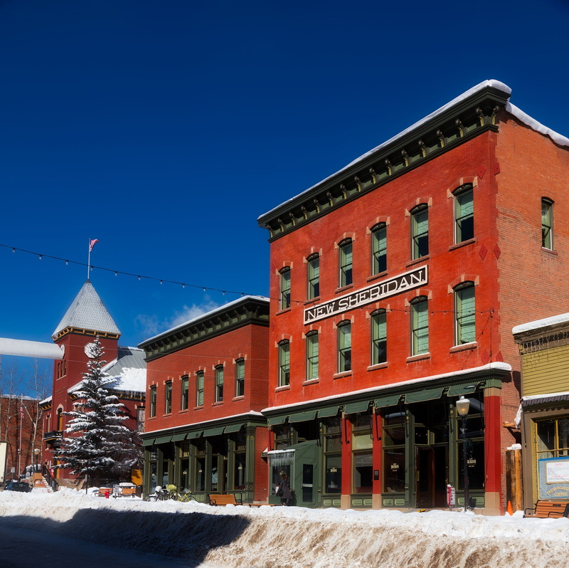 architecture, travel destinations, religion, blue, nature, landmarks, orange, building exterior, snow, hotel, buildings, outside, daytime, colorado, concrete