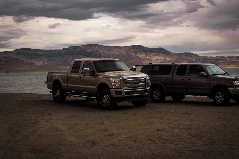 sand, day, trucks, sky, transportation system, transportation, photography, scenics - nature, wheels, car, automobile, parked, landscape, stationary, mode of transportation