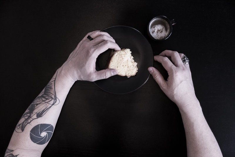 adults only, black background, indoors, human Hand, adult, people, food, bread, one person, studio shot, holding, arm, women, hand, plate, human body part
