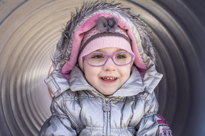 looking at camera, hood - clothing, girls, children only, one person, little girl, childhood, kid, innocence, clothing, hood, cute, smiling, real people