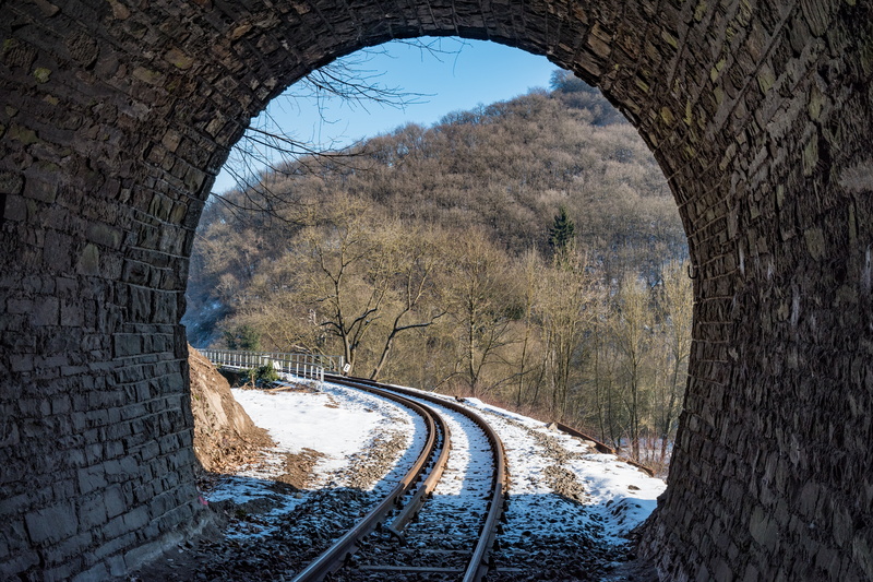 train - vehicle, track, brohltalbahn, bare tree, tunnel, built structure, outdoors, architecture, railway tunnel, direction, tree, brohltal, rail transportation
