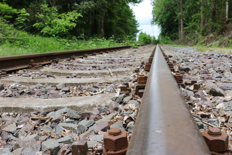 stone - object, protection, loco, rail transportation, rail traffic, narrow gauge railway, surface level, railroad track, diminishing perspective, public transportation