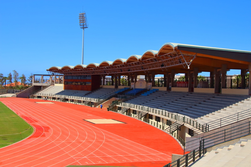 Athletics, building exterior, travel destinations, 5K, roof, sunlight, red, stadium, seat, no people, built structure, Track, nature, city, blue, clear sky