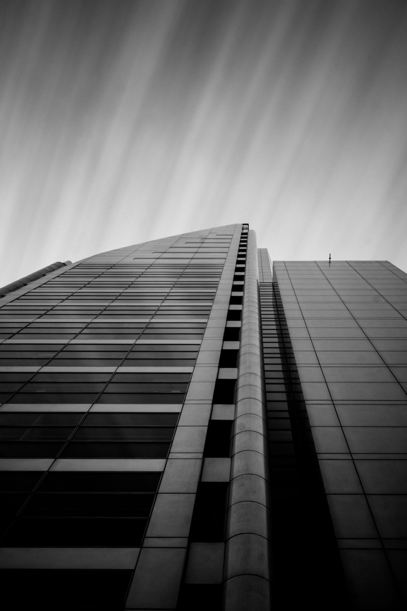 black and white, glass - material, day, urban, sky, angle, modern, outdoors, office building exterior, chile, directly below, photography, office building