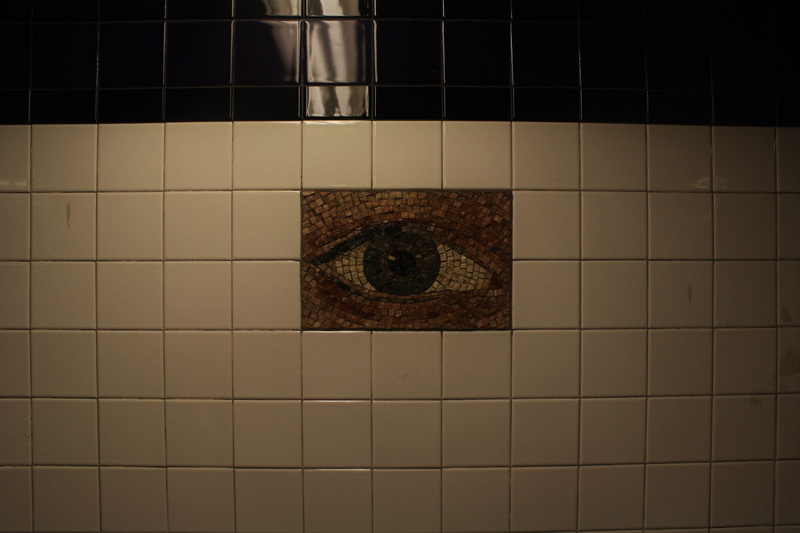 shape, tile, dark, tile art, architecture, day, security, eyes, queens, subway, pattern, bathroom, built structure, manhattan, circle, no people, brooklyn
