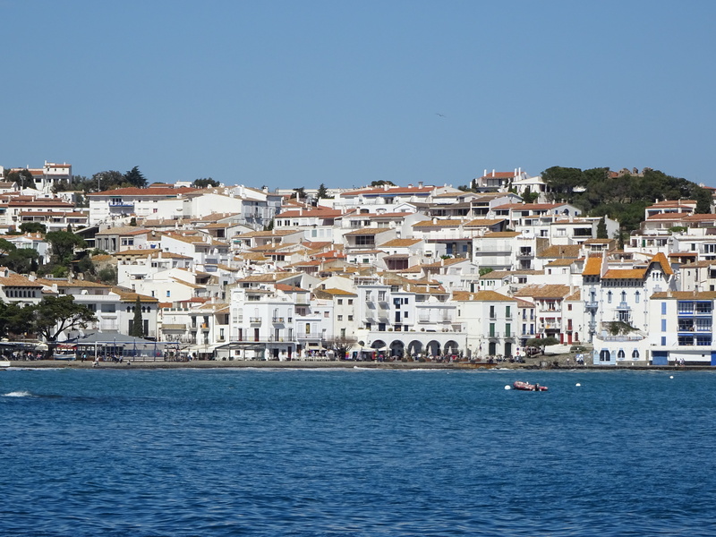 sea, cityscape, blue, sky, cadaqués, outdoors, architecture, townscape, building, built structure, residential district, clear sky, nature, city, tourism