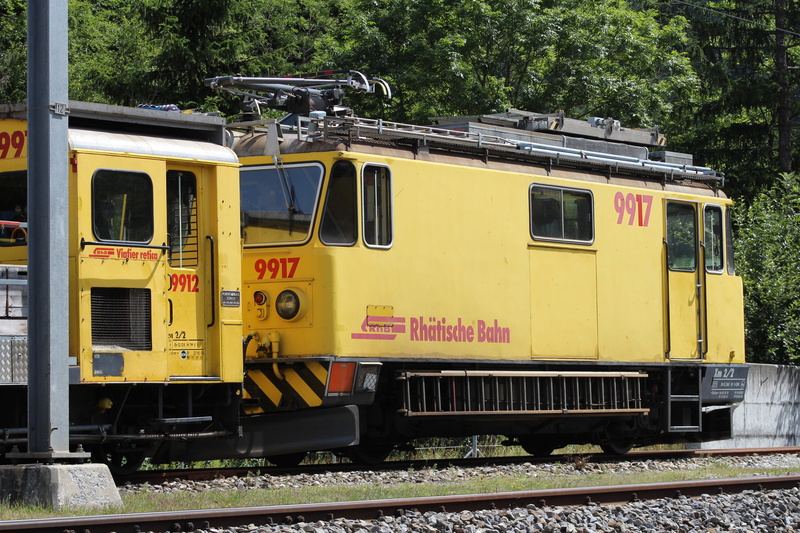 day, train - vehicle, track, public transportation, railroad track, train, object, tree, nature, land vehicle, mode of transportation, outdoors, travel