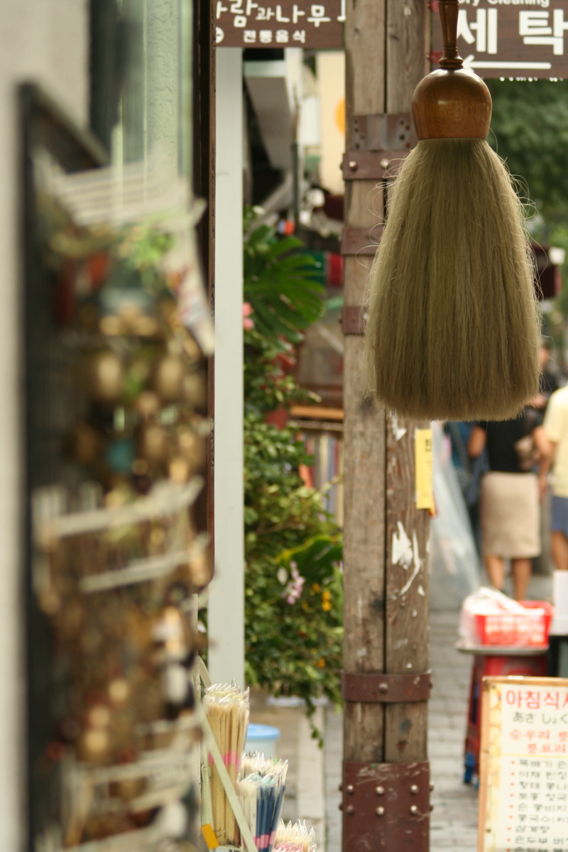 lifestyles, store, korean, architecture, asia, real people, retail, rear view, landmark, selective focus, outdoors, hairstyle, for sale, alley, women, korea
