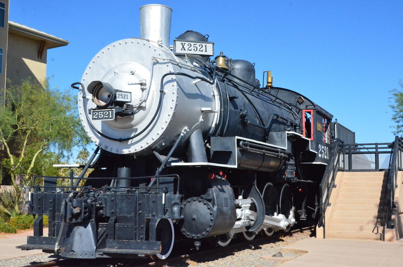 no people, sunlight, train - vehicle, clear sky, mode of transportation, railroad track, nature, outdoors, sky, locomotive, engine, train, metal, track