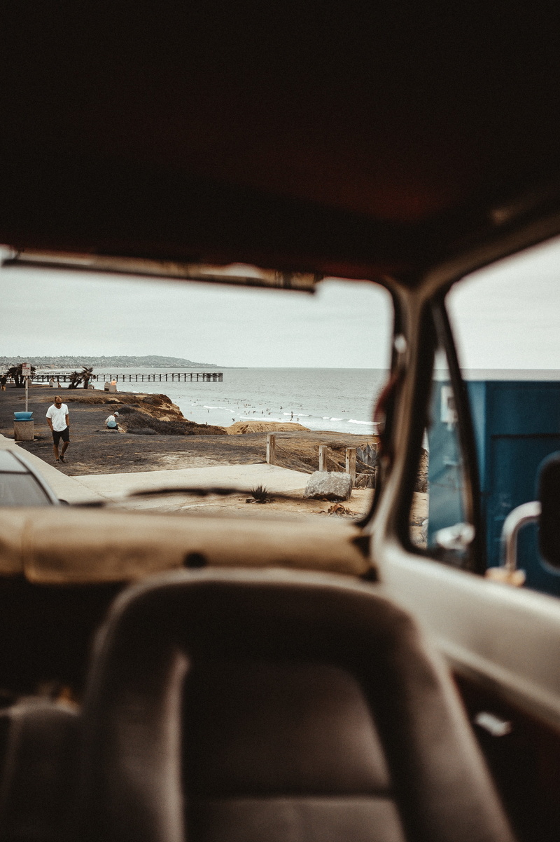 vehicle interior, man, vehicle, dock, selective focus, car, mode of transportation, day, transparent, sea, no people, indoors, water, brown, travel, glass - material