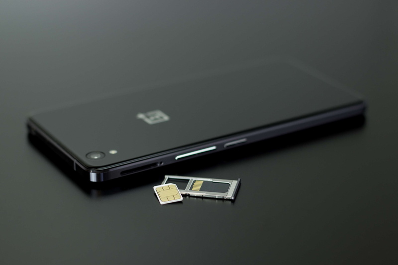 studio shot, touch screen, no people, telecommunications equipment, device screen, indoors, micro simcard, portable information device, data, android phone