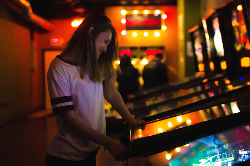 hair, music, adult, young adult, pinball, long hair, focus on foreground, smile, skill, casual clothing, illuminated, musical equipment, night, young women